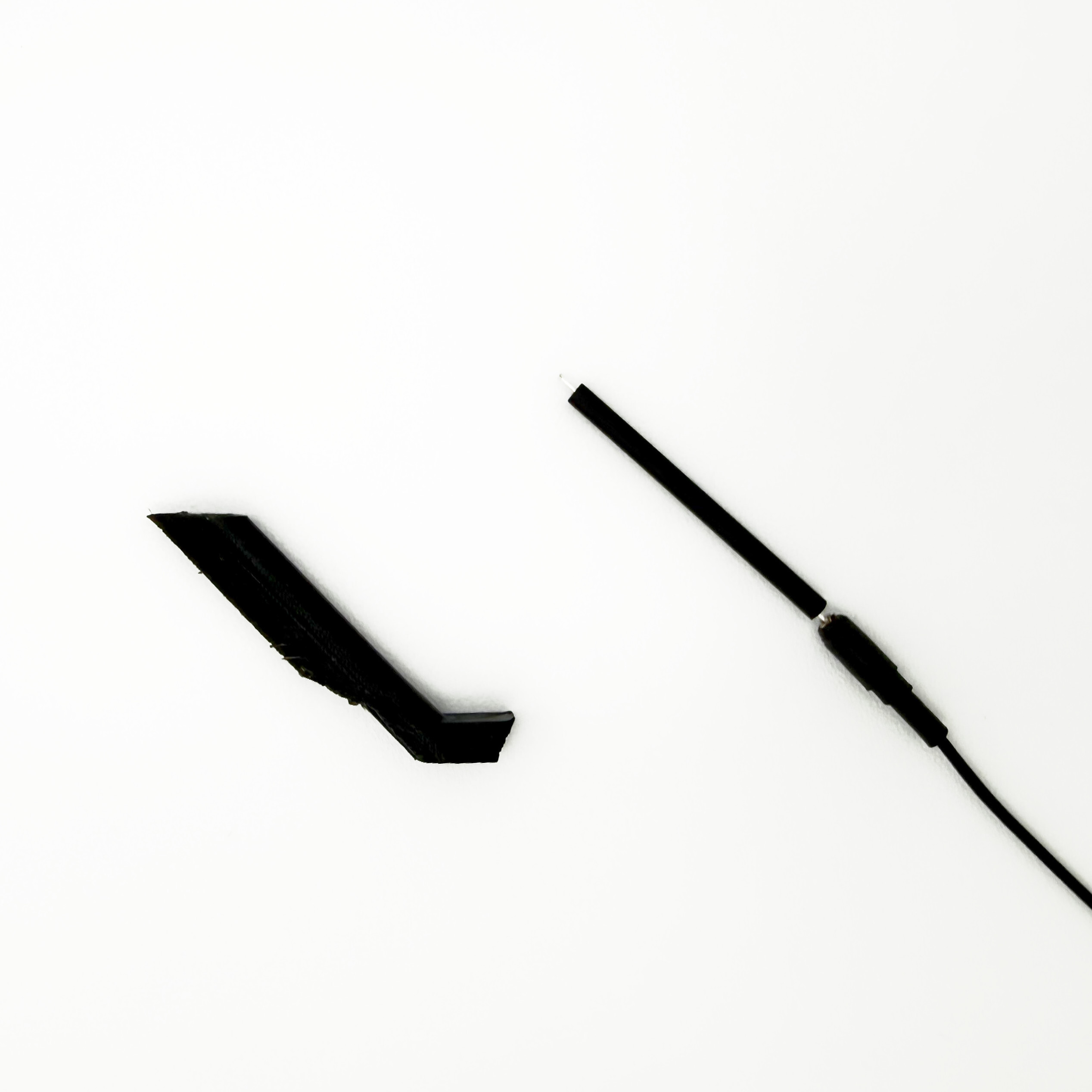 Heat shrink covering antenna beyond the fairing