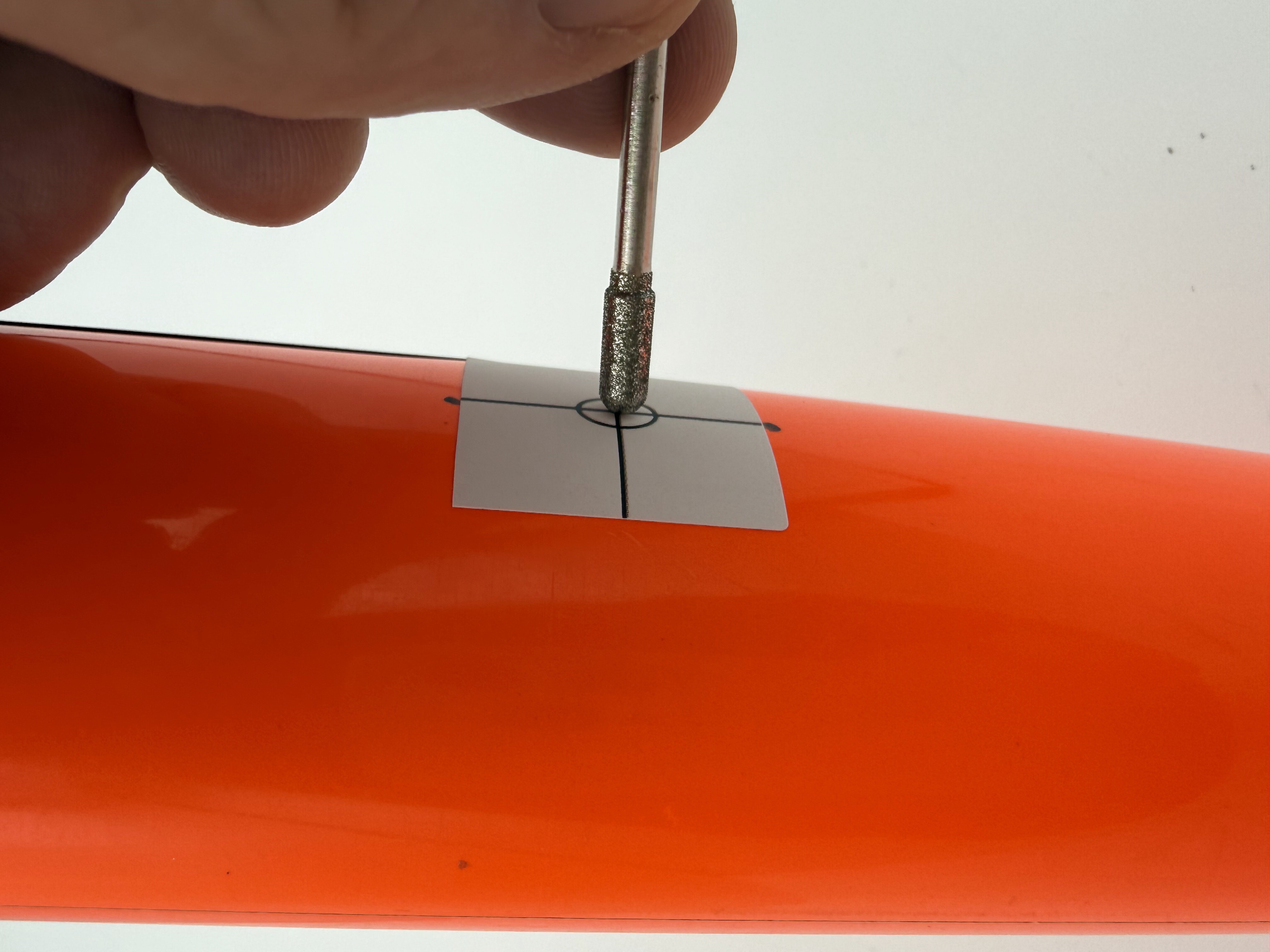 Drilling the initial hole perpendicular to the surface
