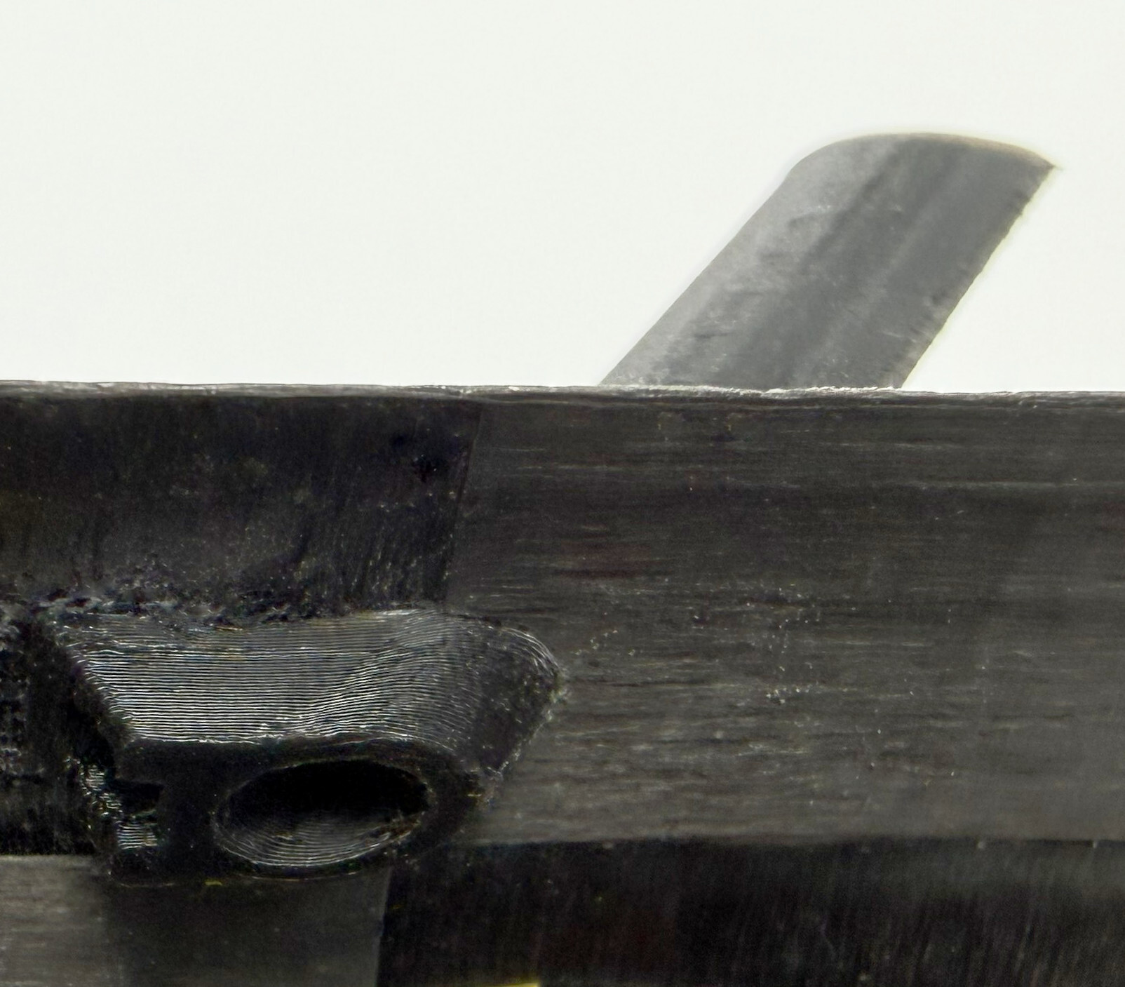 Mounting tab flush against the inner wall