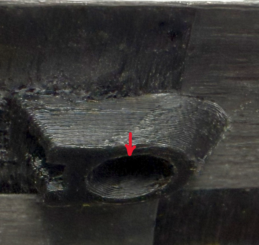 Drop of adhesive where the antenna meets the fairing